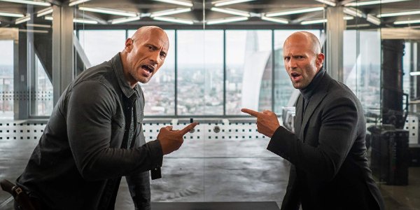 Hobbs &amp; Shaw pointing at each other, calling each other out in a conference room