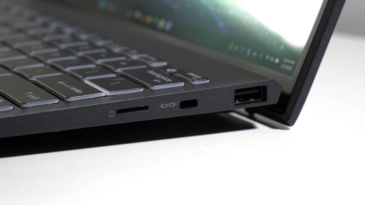 MSI Prestige 13 AI+ Evo open on a white table, highlighting the ports on the right, including USB Type-A, Kensington lock slot, and microSD card slot.