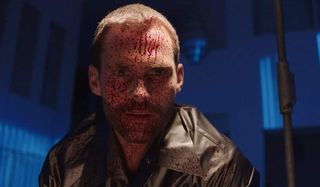 Bloodline Seann William Scott stares in awe with blood splattered on his face