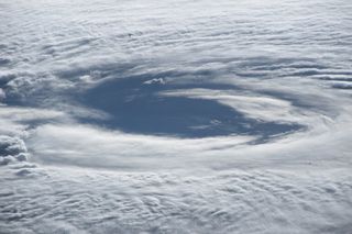 The eye of Hurricane Maria spins beneath the International Space Station in this close-up shot captured by NASA astronaut Randy Bresnik.