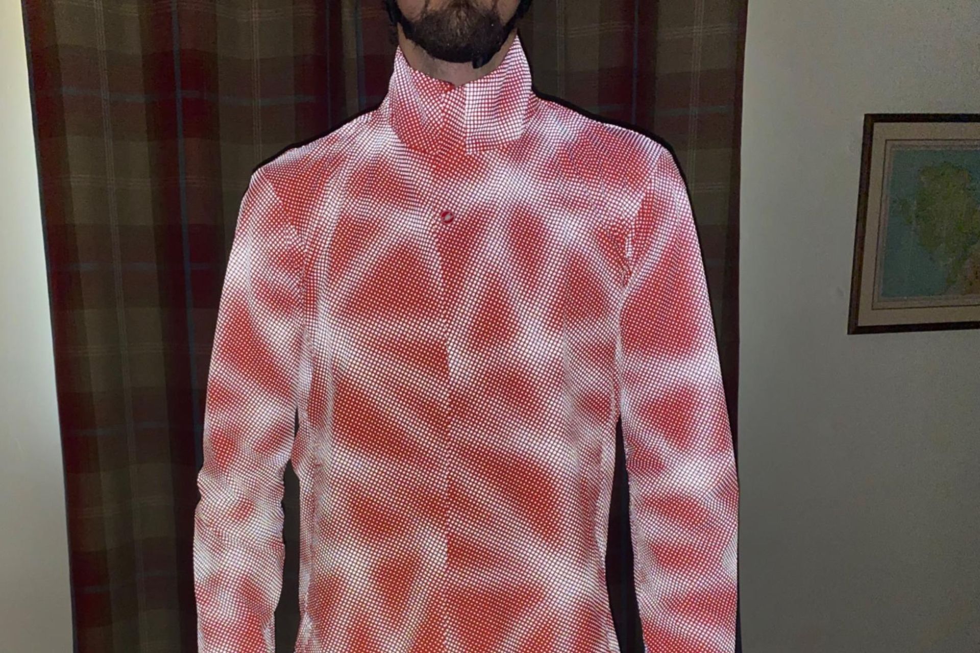 Image shows a rider wearing the Castelli Reflex Commuter Jacket.