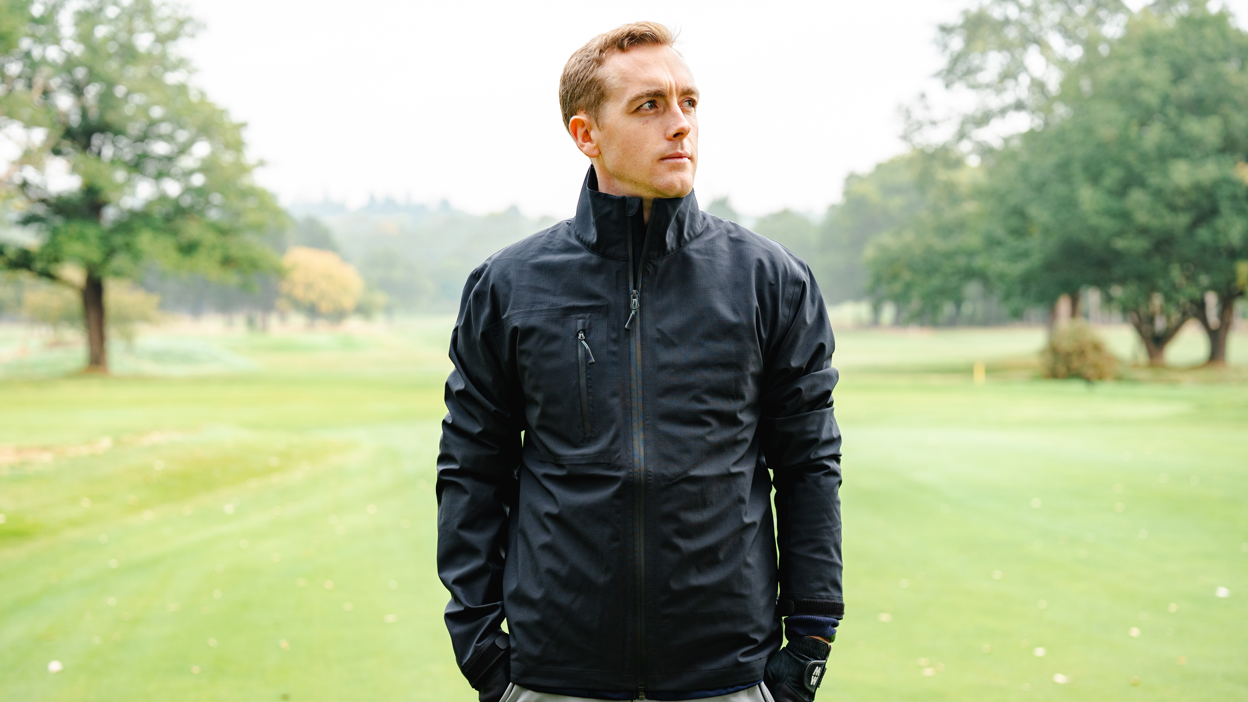 Jonny Leighfield modelling the HLINC Full Zip Waterproof Links Golf Jacket