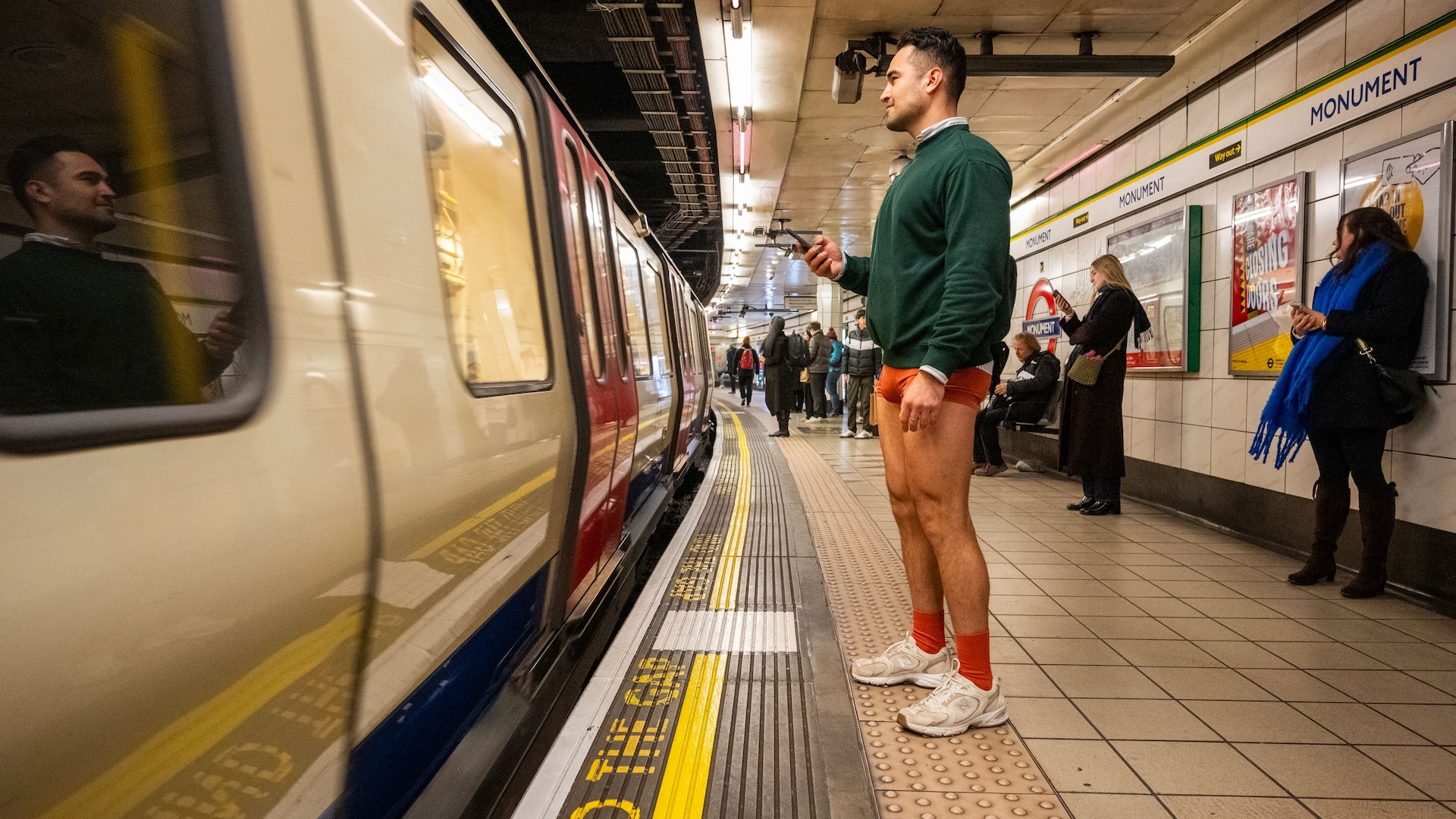  A member of the No Trousers Tube ride awaits his tube on January 12, 2025 in London, England