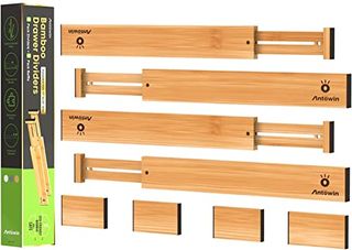 Bamboo drawer dividers with inserts and extendable dividers. On a white background