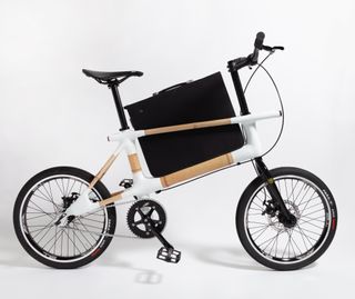 mccloy muchemwa bamboo bike-A bicycle with a briefcase sat in the frame