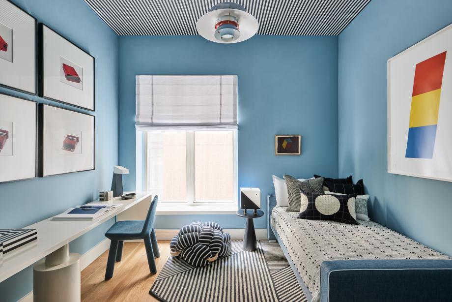 A framed Ellsworth Kelly lithograph adds a pop of colour to this bedroom, featuring lighting by Kelly Behun for Hudson Valley Lighting