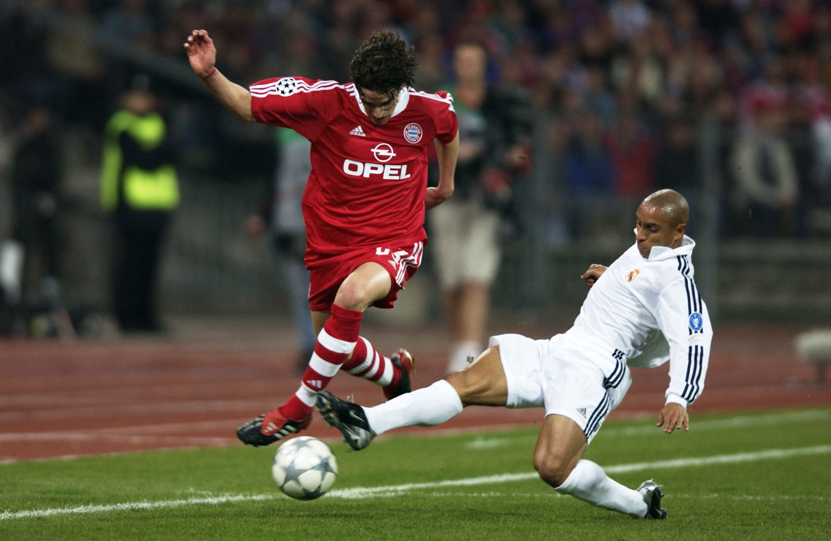 Bayern Munich's Owen Hargreaves takes the ball past Real Madrid's Roberto Carlos in the Champions League in April 2002.