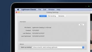 A laptop screen showing an Adobe Lightroom backup