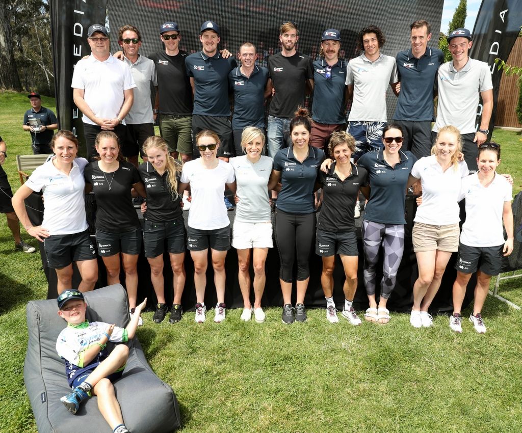 The Orica-BikeExchange and Orica-AIS teams pose for a photo