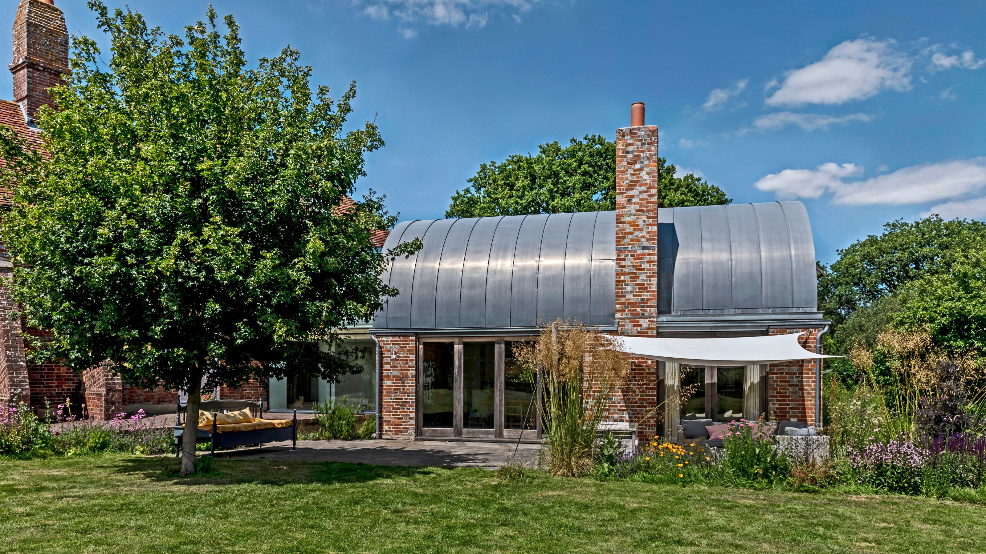 Modern annexe extension with vaulted zinc roof