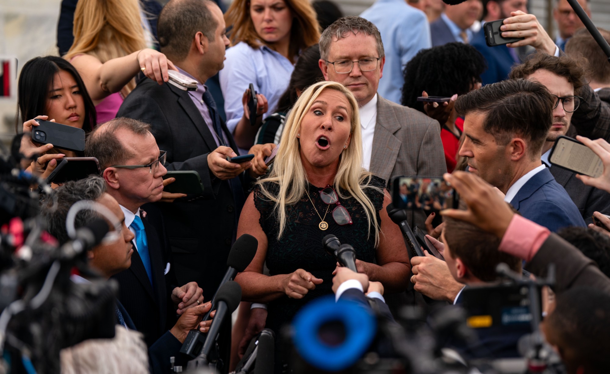 WASHINGTON, DC - MAY 8: Rep. Marjorie Taylor Greene (R-GA), and Rep. Thomas Massie (R-KY), speak to members of the press on the steps of the House of Representatives at the U.S. Capitol on May 8, 2024 in Washington, DC. The House voted overwhelmingly to save Speaker Johnson from Marjorie Taylor Greene's push to oust him from his leadership position, voting 359 to 43 to table the motion to vacate. (Photo by Kent Nishimura/Getty Images)
