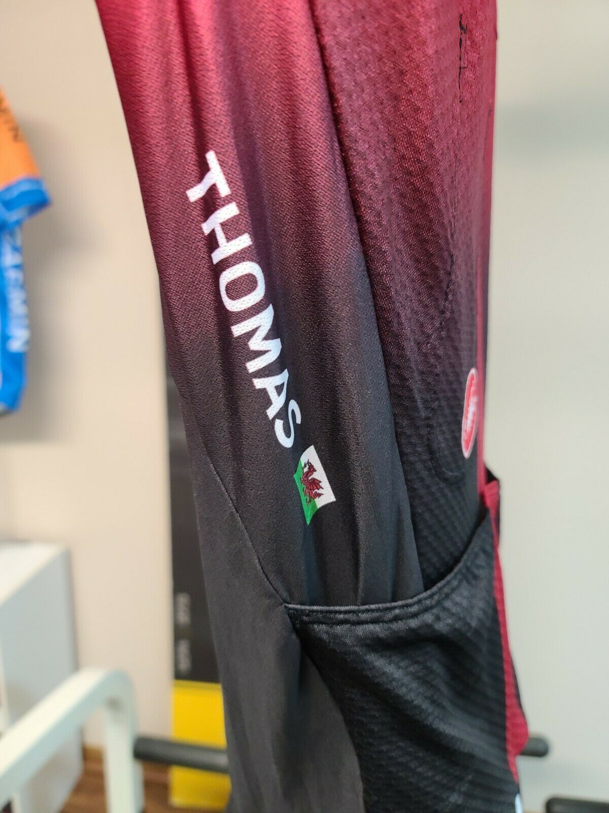 The speed suit proudly displays the Welsh flag alongside his name