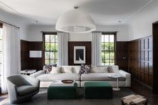 white living room with dark wooden shaker paneling