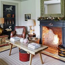 living room with black fireplace and photoframe on white wall