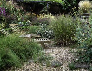 Outdoor seating in a gravel garden of a Mediterranean garden style