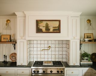 Small white kitchen ideas with war white hood and tiled backsplash in a farmhouse-style kitchen