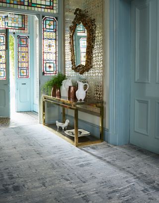 Marianne Cottrell house with gilded mirror and blue walls
