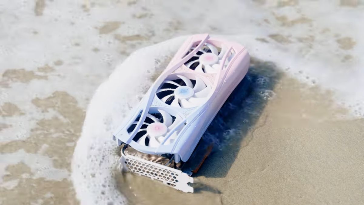 Yeston Sakura Atlantis RX 9070 XT graphics card on a beach with a wave gently crashing into it