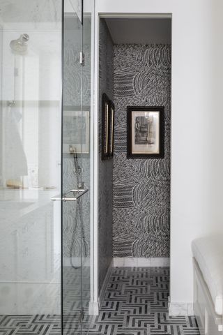 black bathroom with wallpaper and artwork by Kitesgrove
