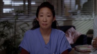 Cristina looking at her heart in a box.