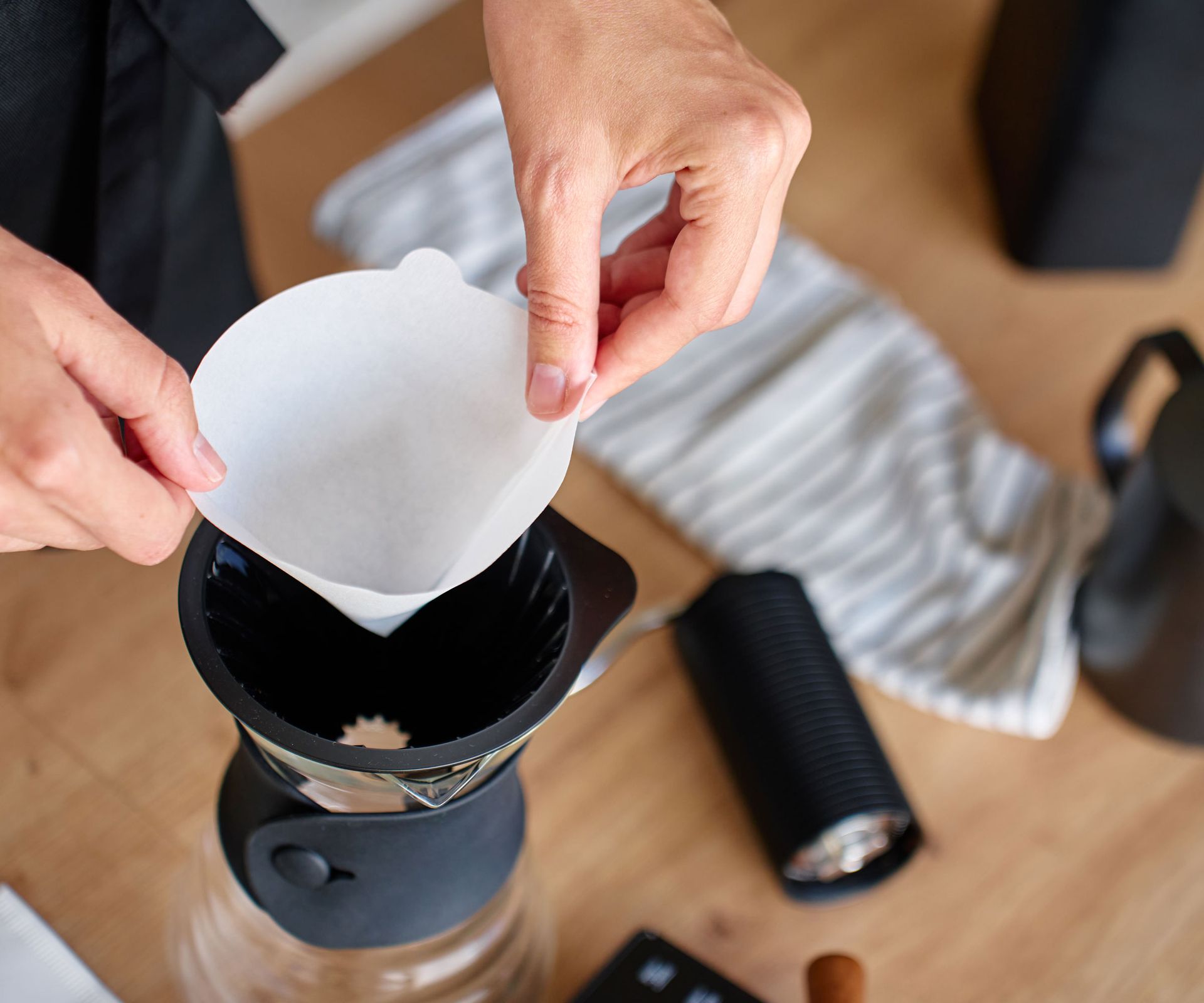 coffee filter being placed in coffee machine