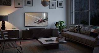 Klipsch soundbar in a living room with grey sofa and gallery wall
