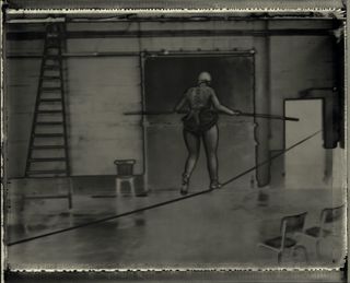 Black and white image of woman on tight rope: La Funambule 2003