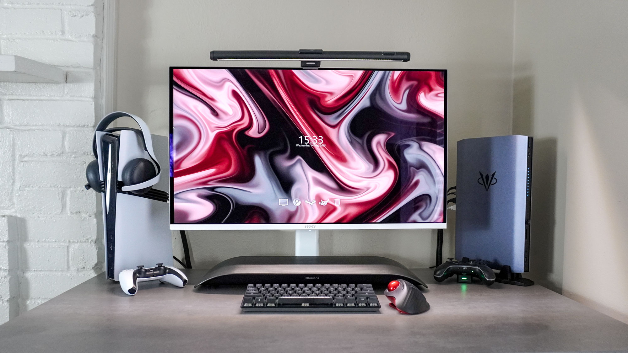 A desk setup built around the MSI MPG 321URXW QD-OLED monitor with the BlueAnt Soundblade underneath it