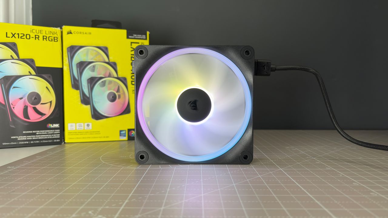 Various PC fans on a table with testing equipment for a round of batch tests.