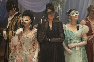 Three women at a Regency-era masquerade ball. Isabella Wei (Posy Li), Katie Leung (Lady Araminta Gun) and Michelle Mao (Rosamund Li), in 'Bridgerton' season 4.