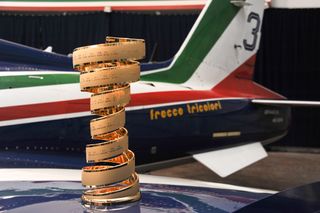 The Giro d'Italia trophy with the Frecce Tricolori plane