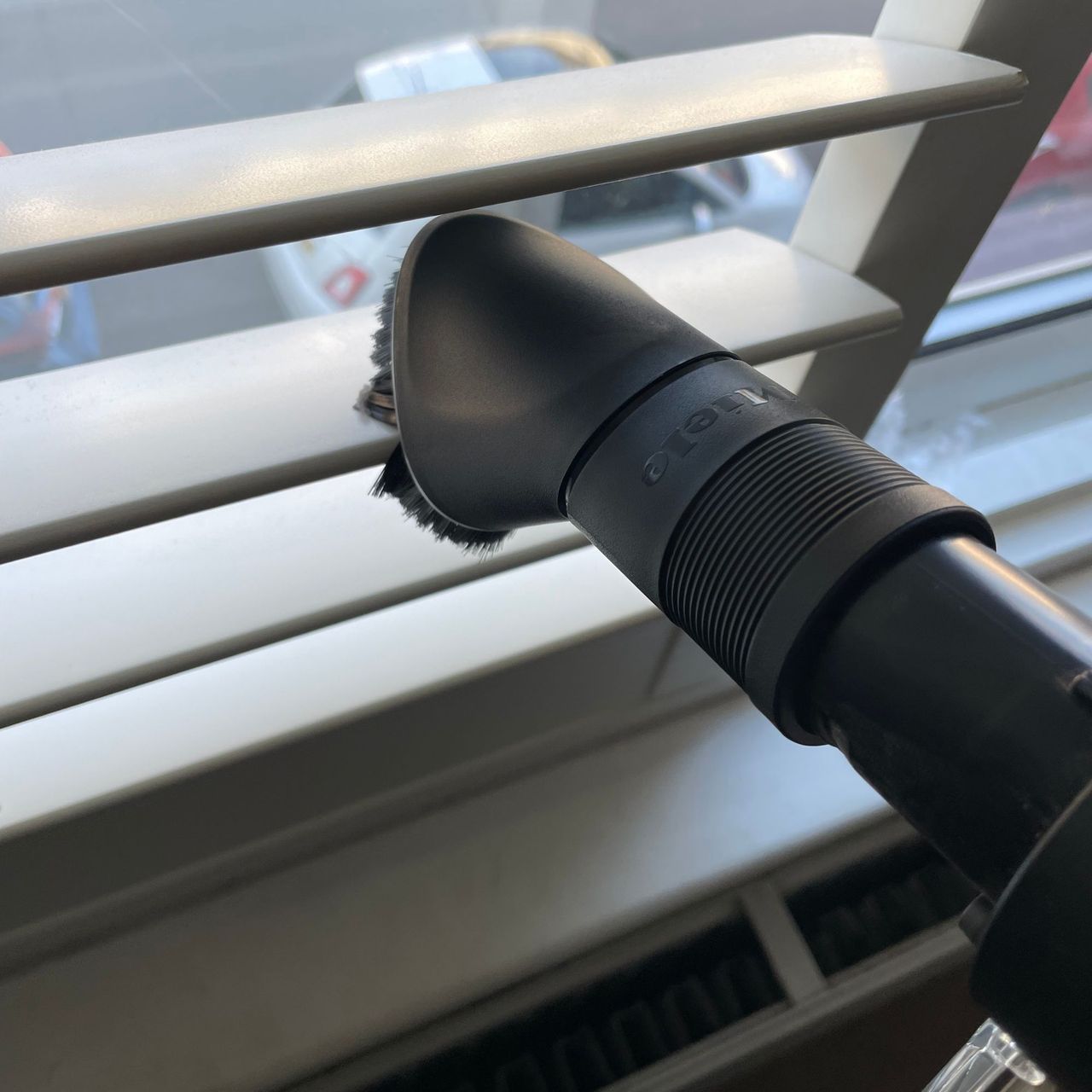 Using the Miele DuoFlex dusting brush on plantation shutters