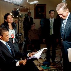 Barak Obama reading the news