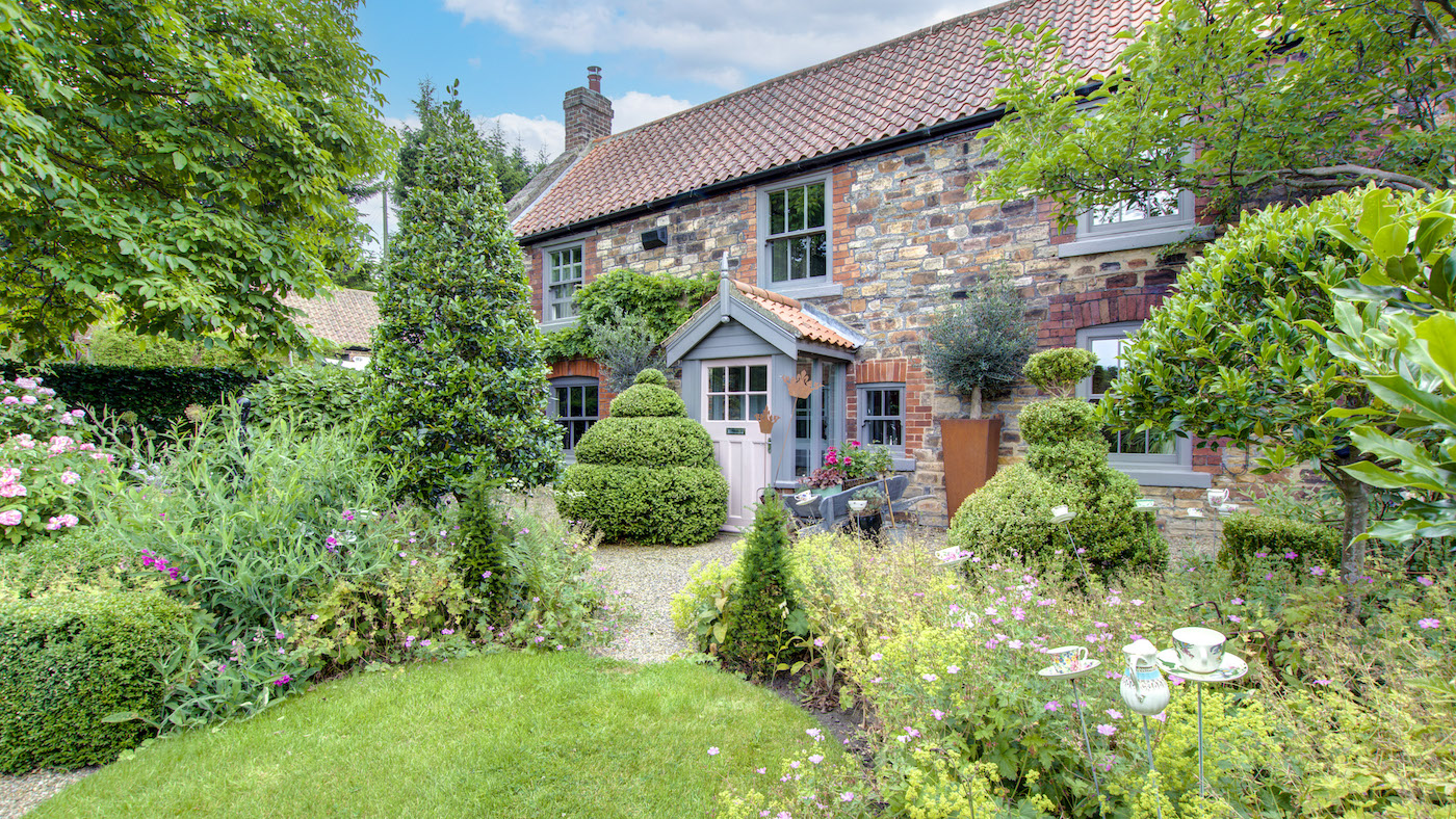 Bleach Green farmhouse is set in pretty gardens