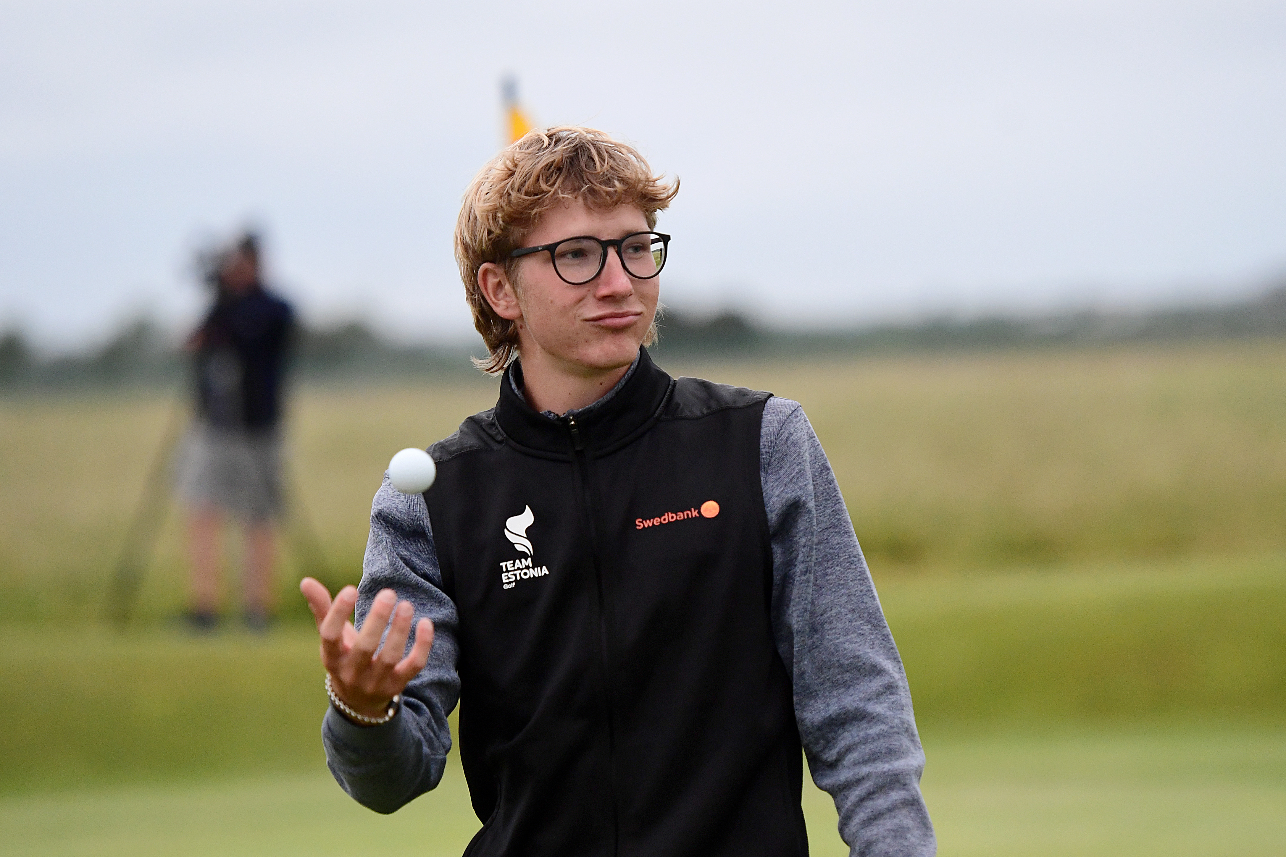 Richard Teder exhales as he walks off the green
