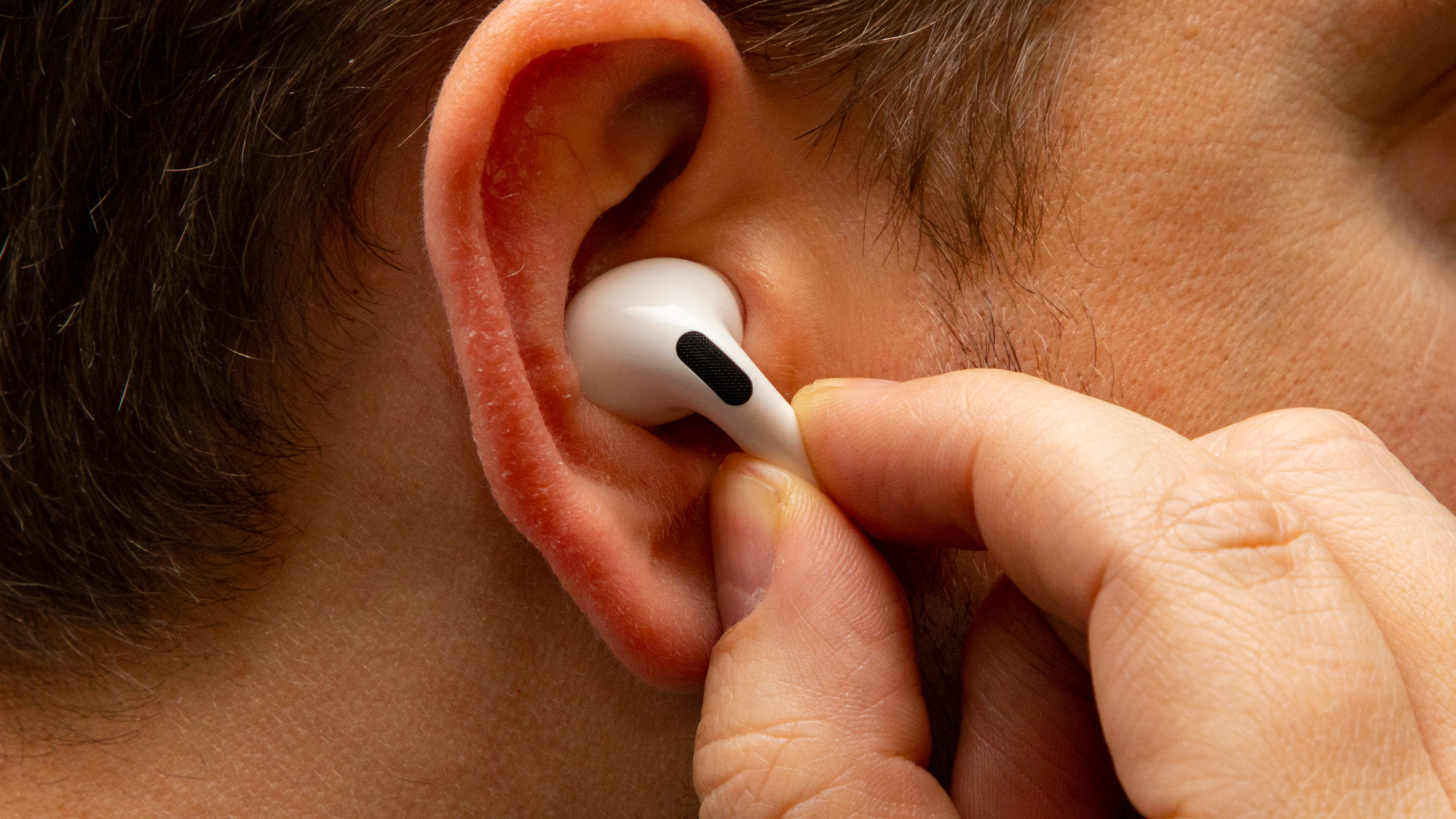 a closeup of the AirPods Pro in someone's ear