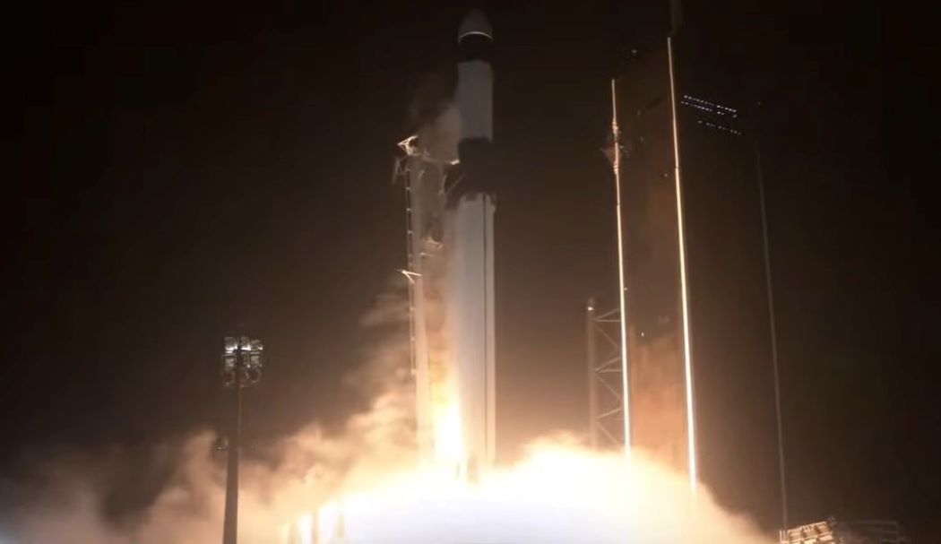 A new SpaceX Falcon 9 rocket and a previously flown Cargo Dragon spacecraft stand atop Pad 39B of NASA's Kennedy Space Center in Florida ahead of a planned Dec. 21, 2021 launch to the International Space Station.