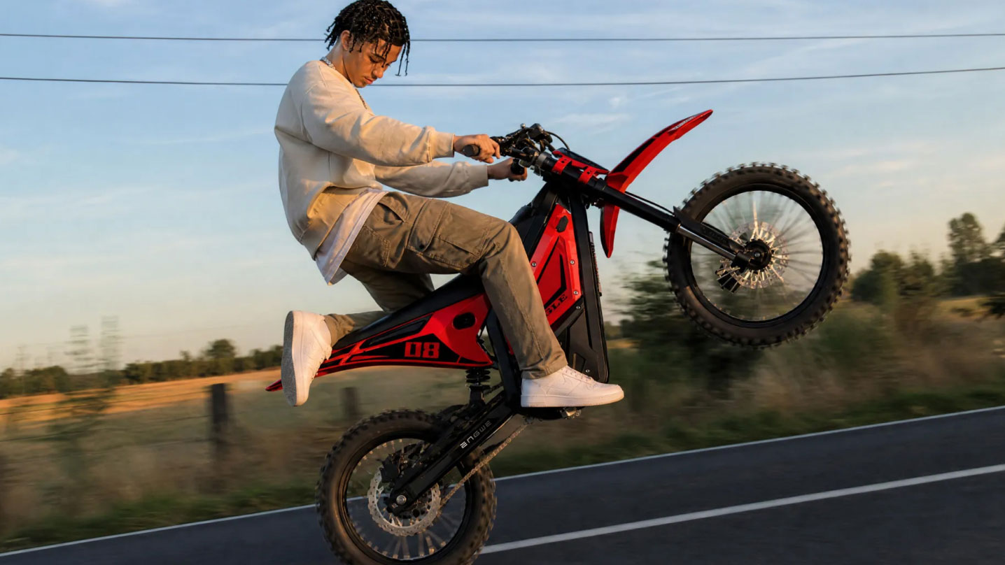 A young rider doing a wheelie on the ENMGWE Eagle