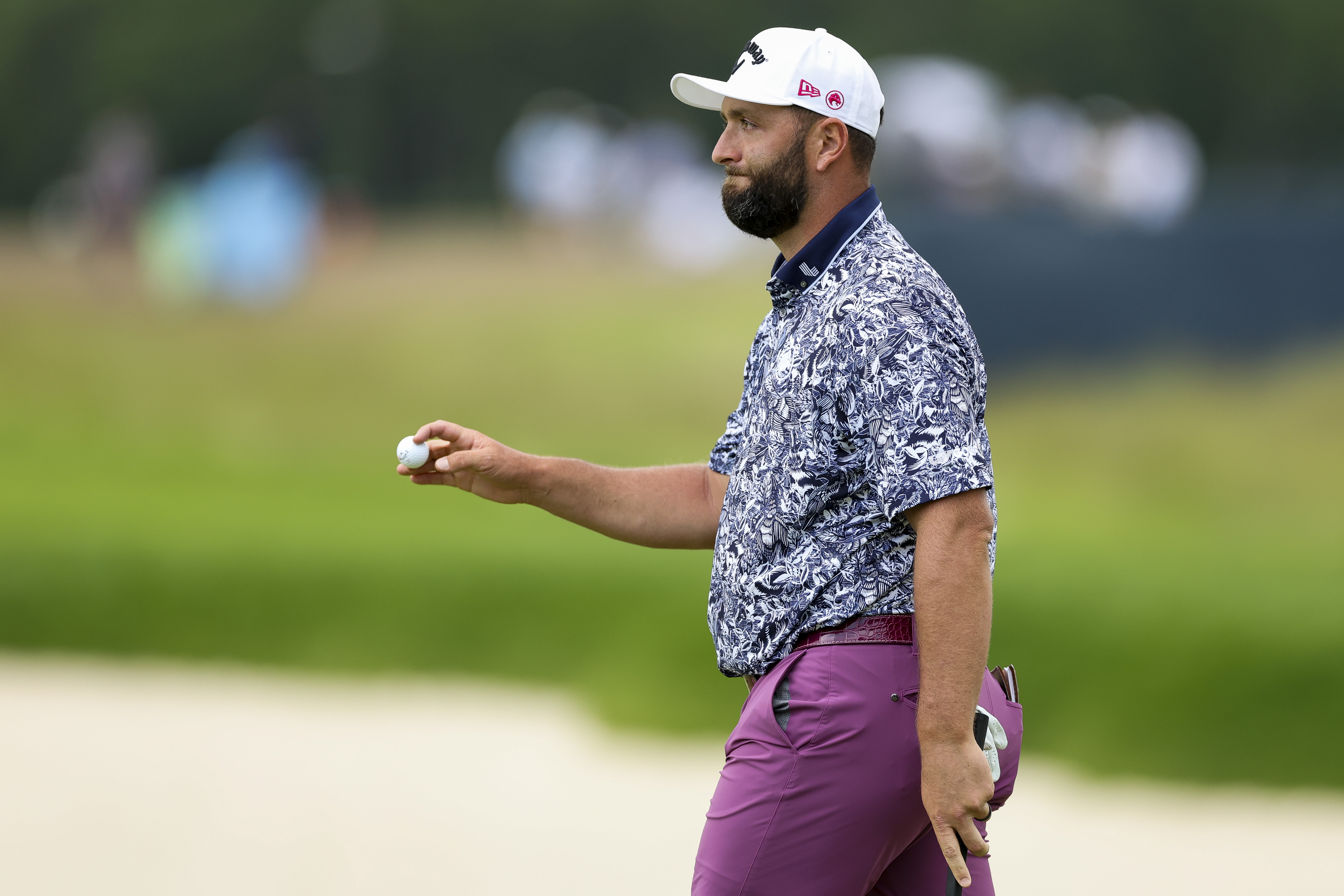 Jon Rahm waves to the crowd