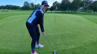 Female golfer on the putting green