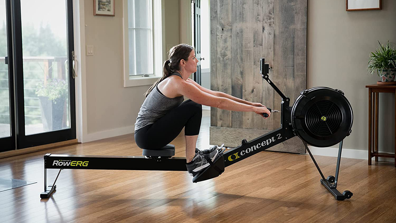 Woman using a Concept2 rowing machine