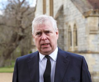 Prince Andrew stood outside a chapel in Windsor