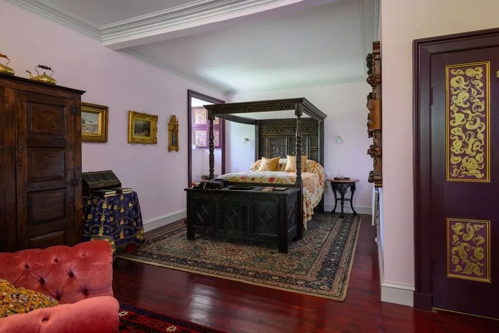 A fancy wooden four-poster bed