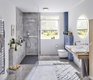 Modern shower room with grey tiling and double sink