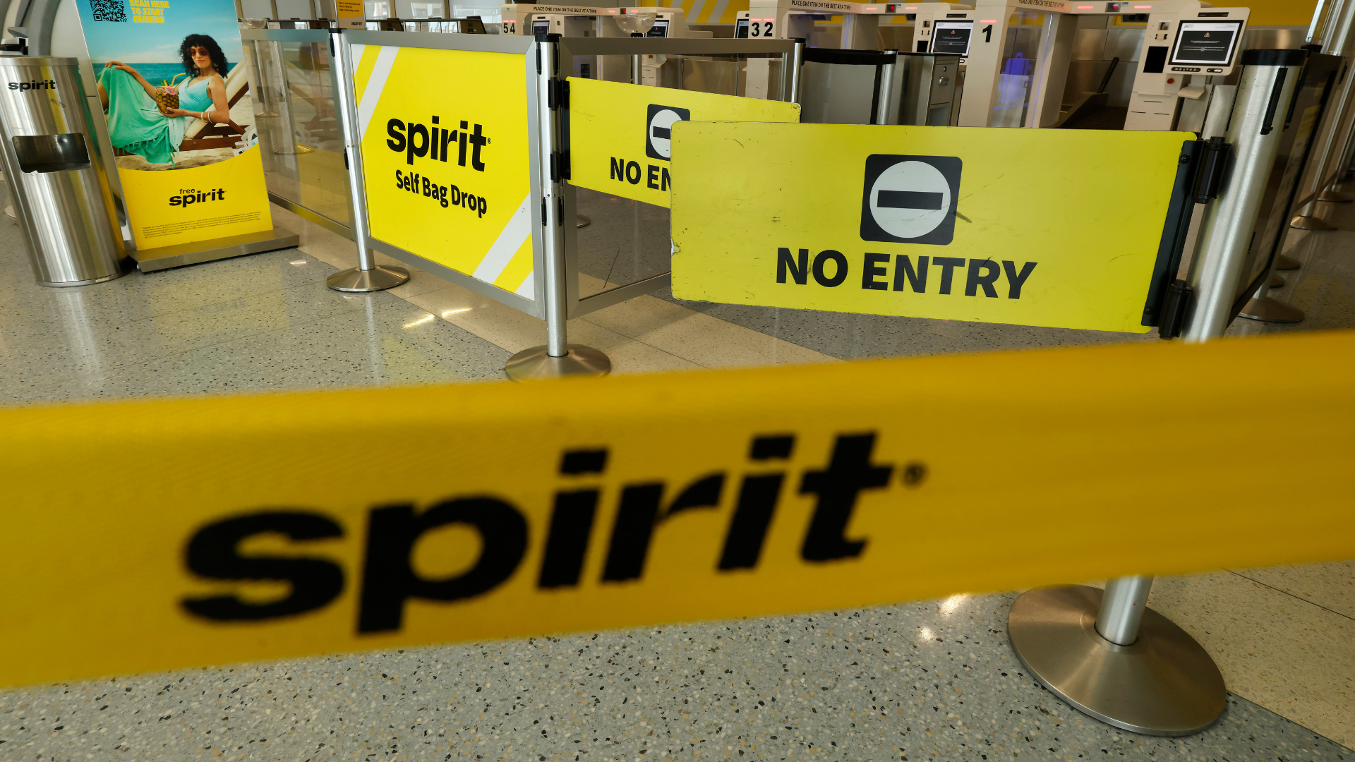 a closed Spirit Airlines gate after the shutdown of the company