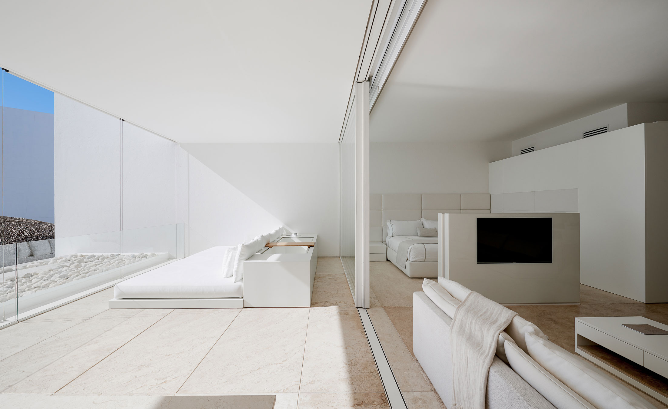 Bedroom/apartment enclosed from sunroom by large sliding door panels