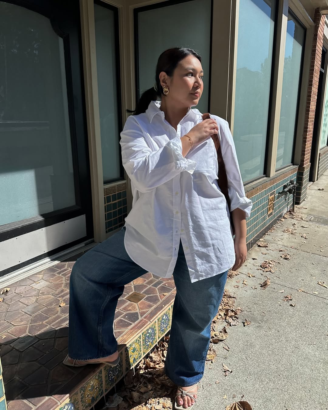 Marina in a white blouse and jeans