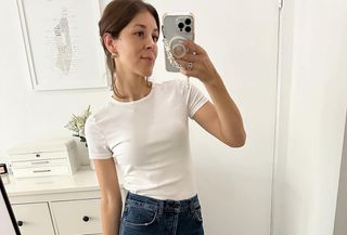 woman in white tee and jeans