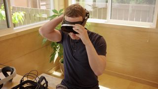 Meta CEO Mark Zuckerberg trying on a prototype VR headset.
