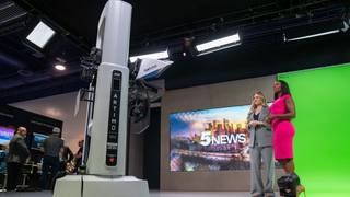 Ross Video robotic camera in a green screen studio with two women newscasters.